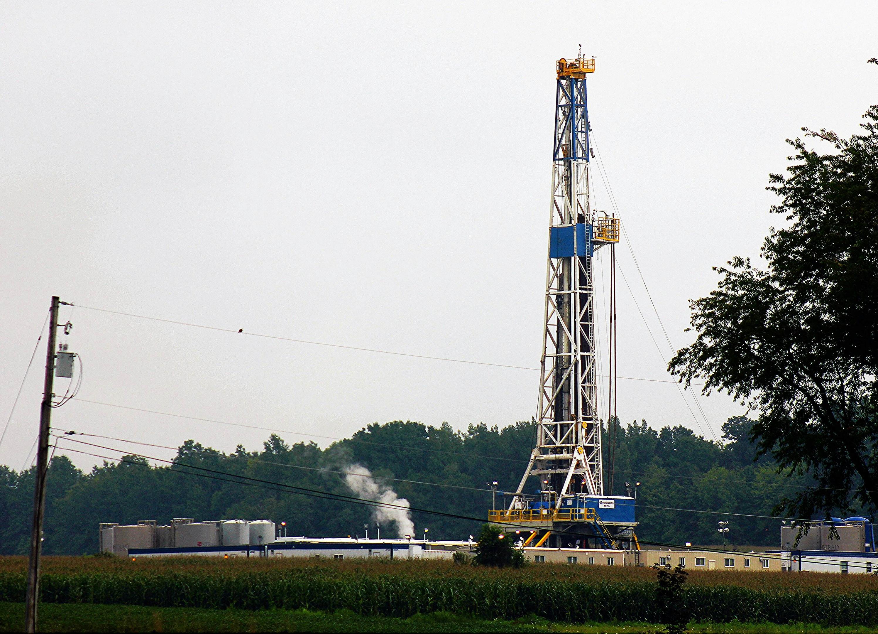 An oil rig on site drilling.